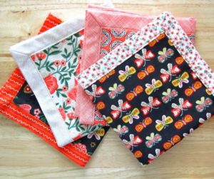 Self Binding Cloth Napkins | Easy DIY sewing project on how to make self-binding cloth napkins for your table setting decor. Make this double-sided mitered napkins by using fat quarter fabric or repurpose materials that perfect for DIY homemade gift or craft for sale.