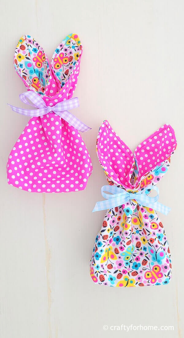 Two bunny bags with ribbon.