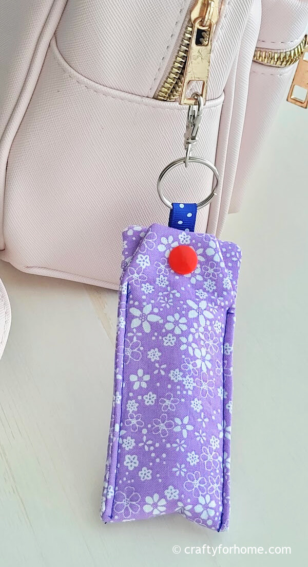 Purple chapstick pouch attach on the backpack.