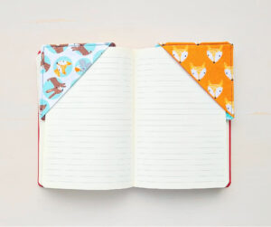 Corner bookmark from orange fabric.