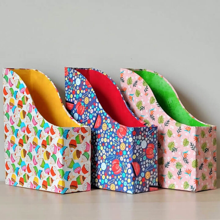 Magazine holder covered with fabric.