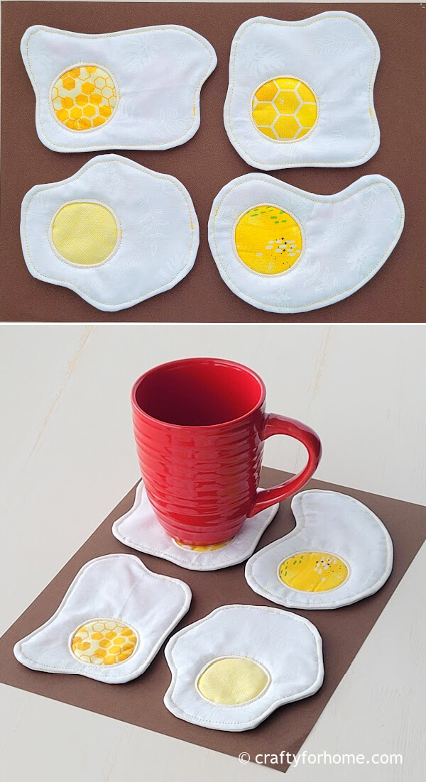 Four fried egg fabric coasters.