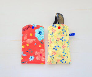 Sunglasses case from red and yellow cotton fabric.