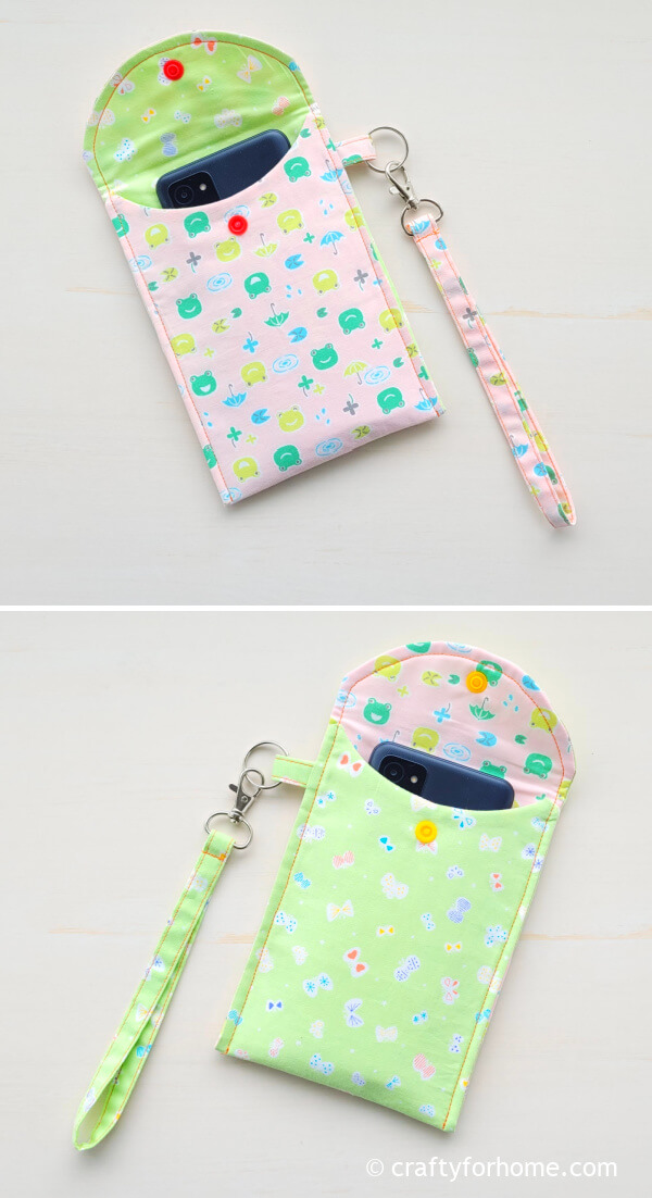 Phone inside the pink and green pouch.