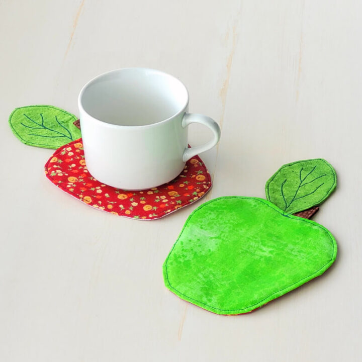 Green and red apple coasters.