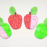 Green and red fabric apple coasters.