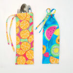 Orange and blue fabric for cutlery drawstring pouch.