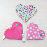 Heart shaped cord wrapper from pink fabrics.