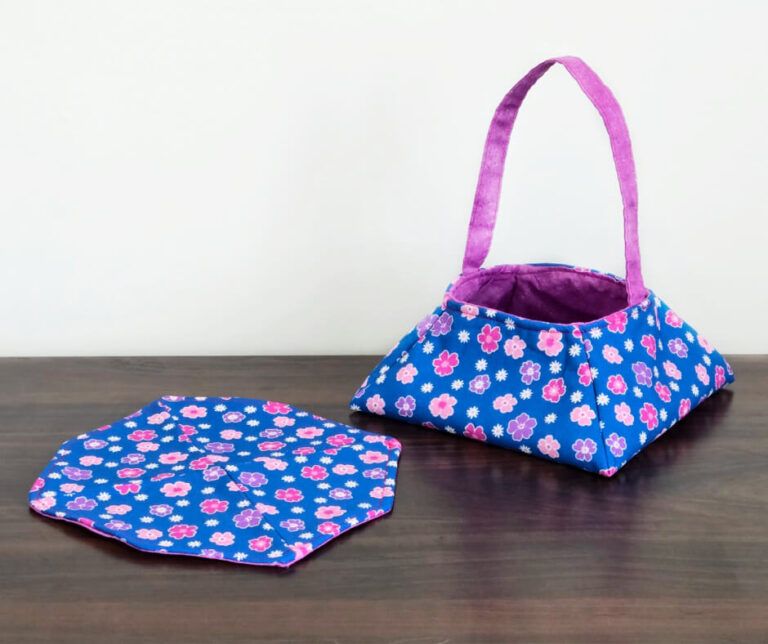 Blue mug rug with blue fabric basket.