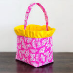 Fabric basket with ruffle top from pink fabric.